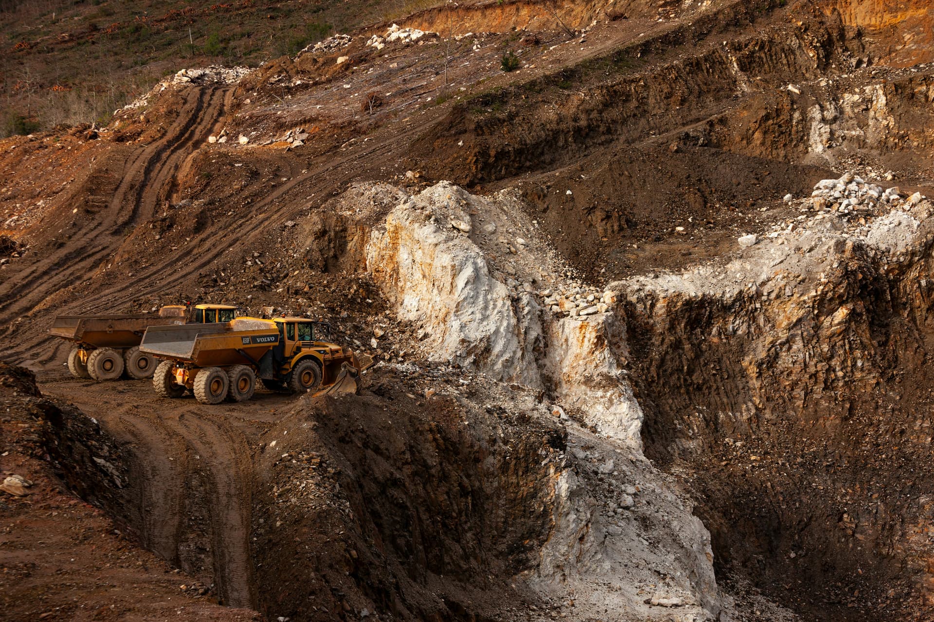 Articulated dump truck on a ramp in an open-cast pit